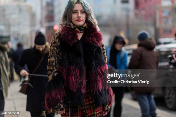 Guest wearing a fur scarf outside 3.1 Phillip Lim on February 13, 2017 in New York City.