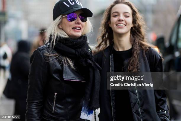 Models wearing cap outside 3.1 Phillip Lim on February 13, 2017 in New York City.