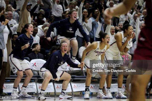 The UConn bench including Tierney Lawlor, Molly Bent, Kyla Irwin, Kia Nurse and Napheesa Collier of the Connecticut Huskies erupts as they celebrate...