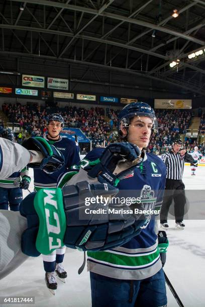 Mathew Barzal of the Seattle Thunderbirds skates by the bench to celebrate a goal by fist bumping teammates against the Kelowna Rockets on February...