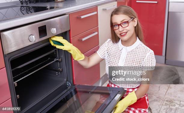 woman cleaning the stove - dirty oven stock pictures, royalty-free photos & images