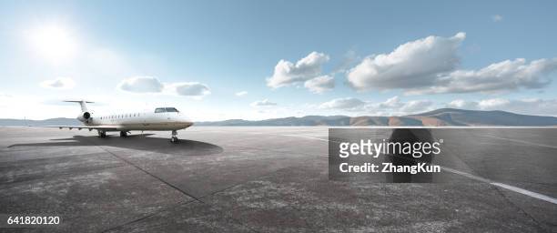 private aircraft parked on the tarmac - avión privado fotografías e imágenes de stock