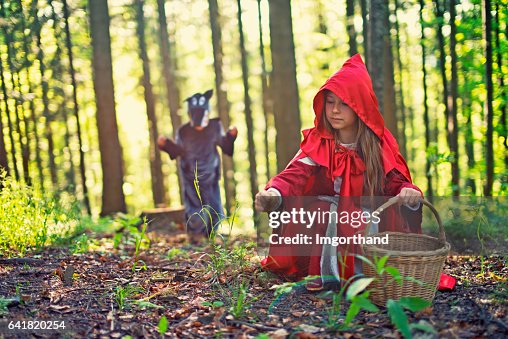 Big Bad Wold sneaking on Little Red Riding Hood Big Bad Wold sneaking on Little Red Riding Hood