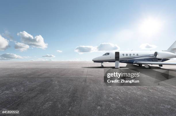 private aircraft parked on the tarmac - corporate jet stock pictures, royalty-free photos & images