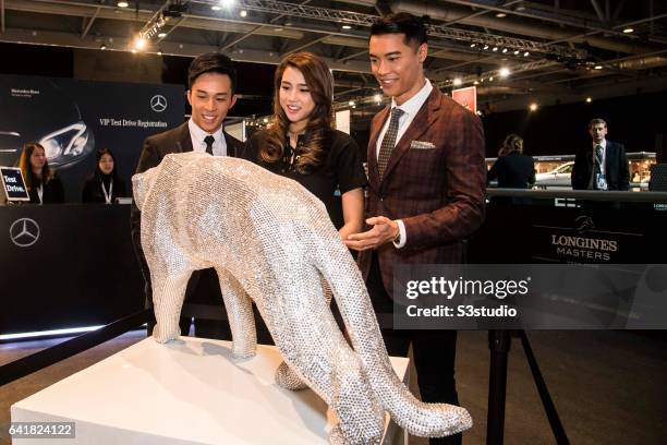 Freeyon Chung, Mr Hong Kong 2016 second runner-up, Tiffany Lau, Miss Hong Kong 2016 first runner-up, and Jackson Lai, Mr Hong Kong 2016, arrive at...