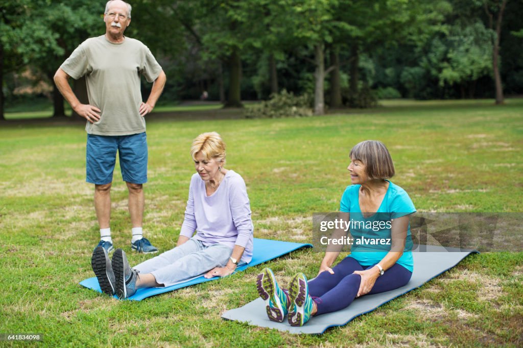 Senior people doing exercise in park