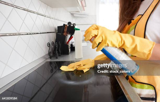 cleaning the stove - clean oven stock pictures, royalty-free photos & images
