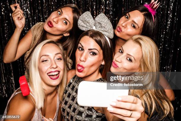 friends making faces while taking selfie at party - pouting stock pictures, royalty-free photos & images