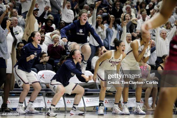 The UConn bench including Tierney Lawlor, Molly Bent, Kyla Irwin, Kia Nurse and Napheesa Collier of the Connecticut Huskies erupts as they celebrate...