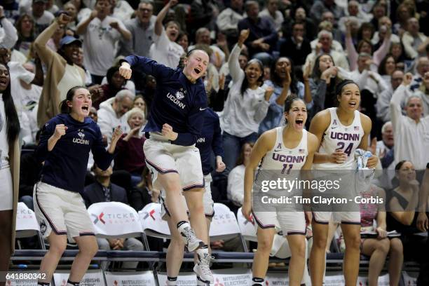 The UConn bench including Tierney Lawlor, Molly Bent, Kyla Irwin, Kia Nurse and Napheesa Collier of the Connecticut Huskies erupts as they celebrate...