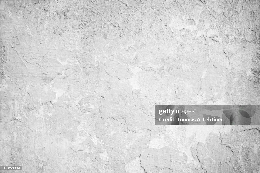 Weathered and peeled off concrete wall texture in black&white.