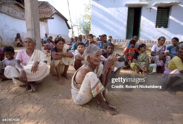 Women and young children among members of the Tevar caste protectively sit together October 1, 1997 in Karaiyiruppu, India. Karaiyiruppu residents...