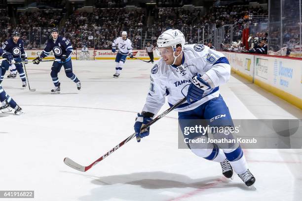 Gabriel Dumont of the Tampa Bay Lightning follows the play down the ice during first period action against the Winnipeg Jets at the MTS Centre on...