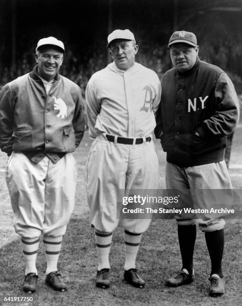 Left to Right - Tris Speaker, Ty Cobb center both with the Philadelphia Athletics, pose for a portrait with New York Yankees, Babe Ruth before a game...