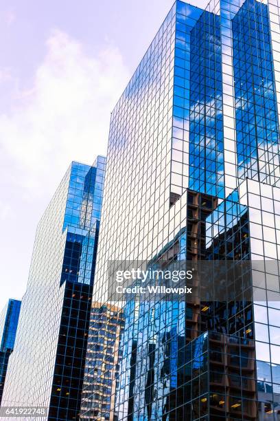 corporate office buildings reflected in bright sunshine skyscraper windows - ottawa building stock pictures, royalty-free photos & images