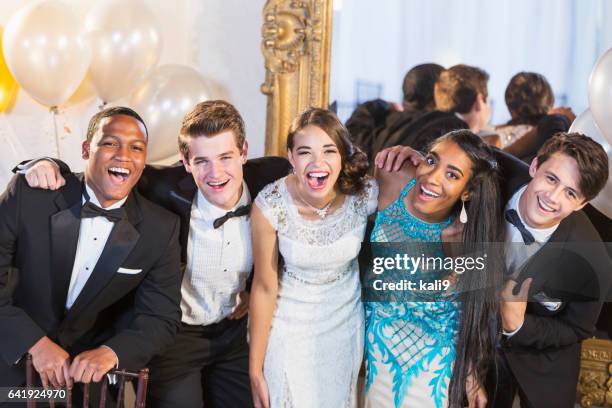 teenagers and young adults in formalwear at party - prom imagens e fotografias de stock