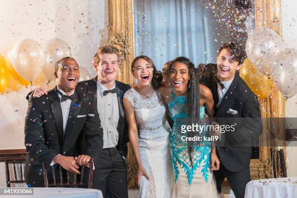 teenagers and young adults in formalwear at party - prom stock pictures, royalty-free photos & images
