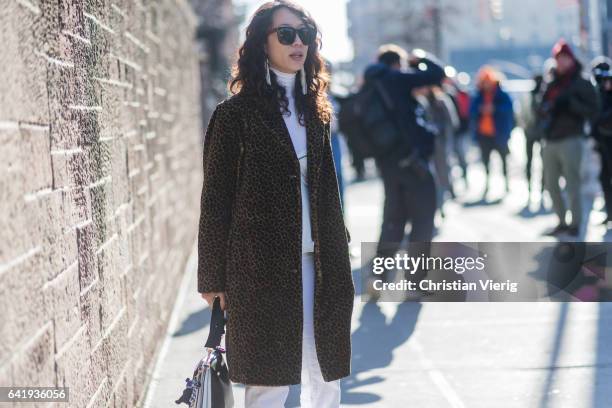 Guest wearing a leoprint coat outside Gabriela Hearst on February 14, 2017 in New York City.