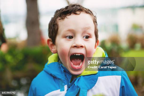 little boy with funny face - kid middle finger imagens e fotografias de stock