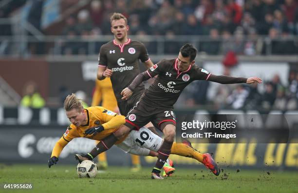 Marvin Stefaniak of Dynamo Dresden and Waldemar Sobota of St. Pauli battle for the ball during the Second Bundesliga match between FC St. Pauli and...