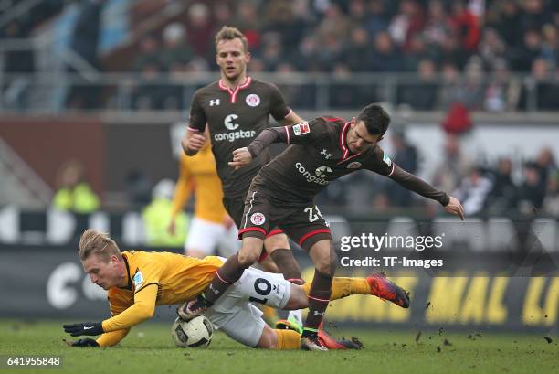 Marvin Stefaniak of Dynamo Dresden and Waldemar Sobota of St. Pauli battle for the ball during the Second Bundesliga match between FC St. Pauli and...