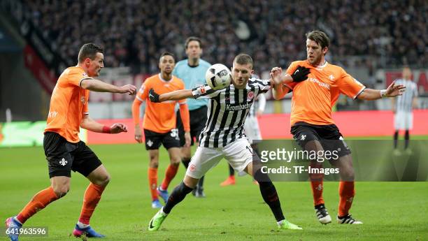 Artem Fedetsky of Darmstadt and Ante Rebic of Frankfurt and Peter Niemeyer of Darmstadt battle for the ball during the Bundesliga match between...
