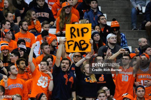 Fan holds a sign in honor of former Syracuse Orange player Fab Melo during the first half of the game against the Louisville Cardinals at the Carrier...