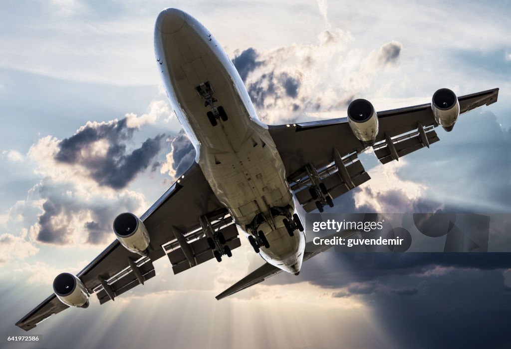 Passenger jombo jet over clouds