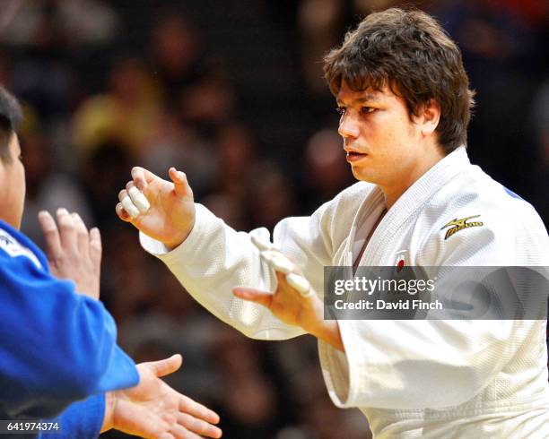 Double world silver medallist, Ryu Shichinohe of Japan , tries to grip Takeshi Ojitani, also of Japan. Ojitani won the heavyweight gold medal after...