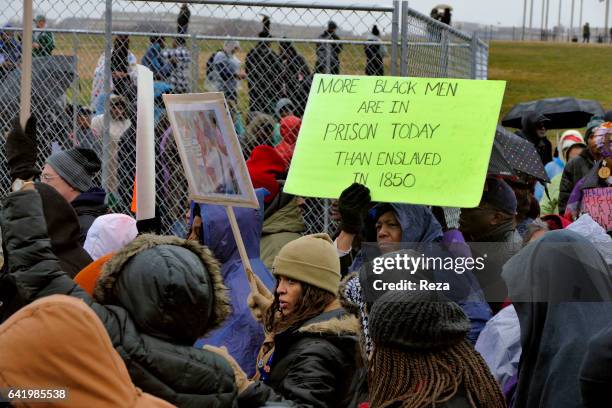 On Martin Luther King Day, hundreds gather for a commemorative walk, brandishing placards against the massive incarceration of African-Americans in...
