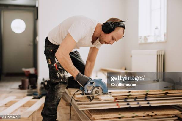 man working and renovating a house - snickeriarbete bildbanksfoton och bilder