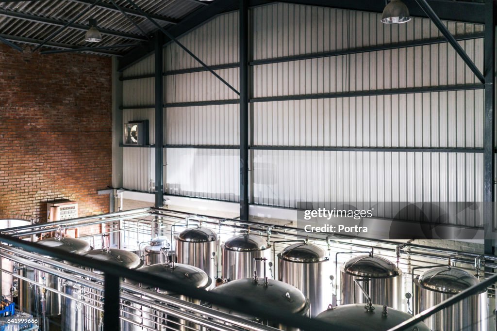 High angle view of steel vats in brewery