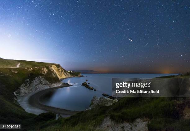 man-o-war bay at night - jurassic coast world heritage site stock pictures, royalty-free photos & images