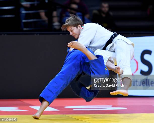 London Olympic champion, Sarah Menezes of Brazil throws Reka Pupp of Hungary for ippon in extra time to win their u52kg contest during the 2017 Paris...