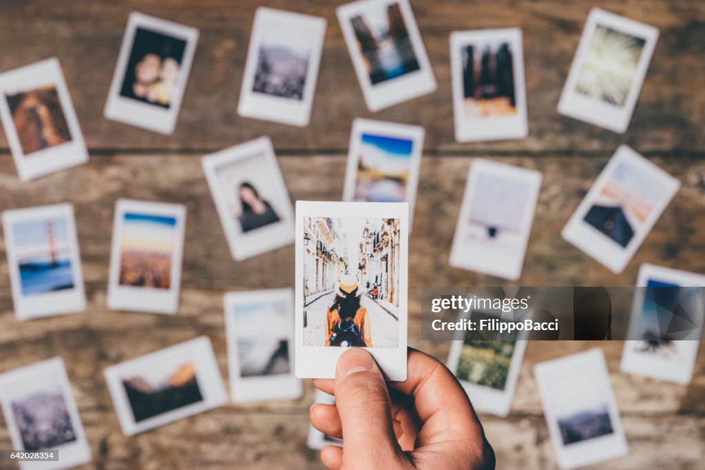 Instant camera prints on a table