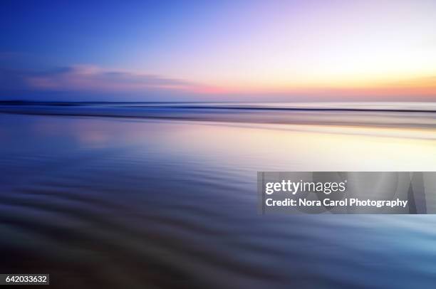 sunset abstract background - horizon over water stock-fotos und bilder