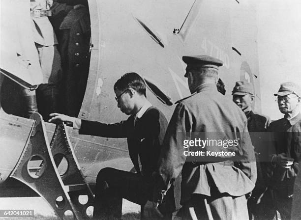 Puyi, or Henry Pu Yi , the last Emperor of China, is transported by plane to Mukden , having been captured by the Soviet Red Army, 2nd October 1945.