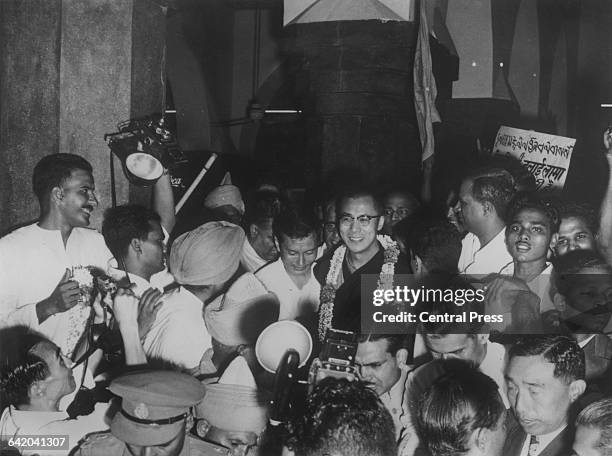 Tenzin Gyatso, the 14th Dalai Lama, arrives at Delhi railway station from Mussoorie, a few months after fleeing Tibet, 7th September 1959.