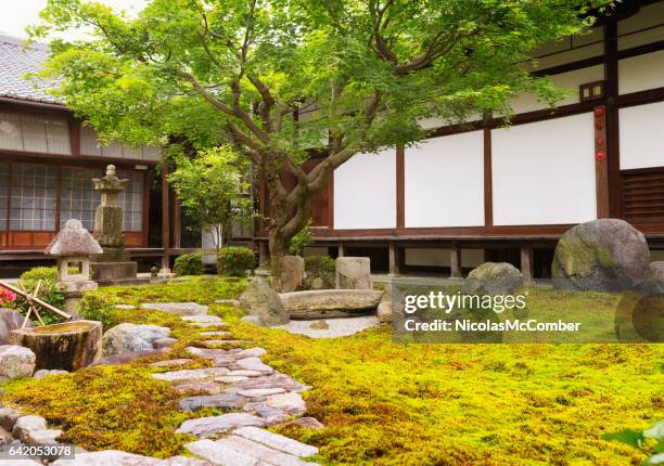 formal rock and moss garden at japanese buddhist temple - zen garden stock pictures, royalty-free photos & images