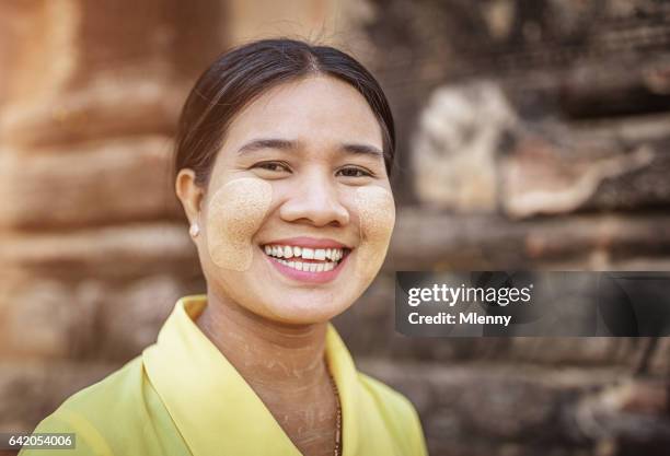 thanaka make-up happy smiling young burmese woman myanmar - myanmar stock pictures, royalty-free photos & images