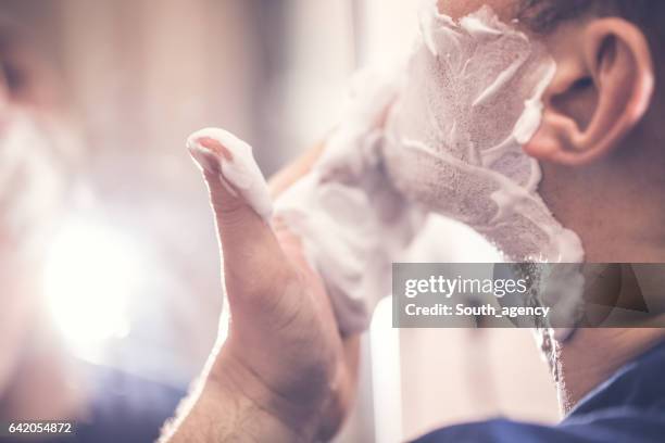 shaving cream softens the beard - shaving cream stock pictures, royalty-free photos & images