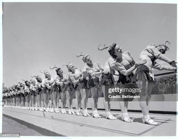 New York, NY-ORIGINAL CAPTION READS: Chorus line- The Rockettes in Rockefeller Center, New York. Undated photograph.