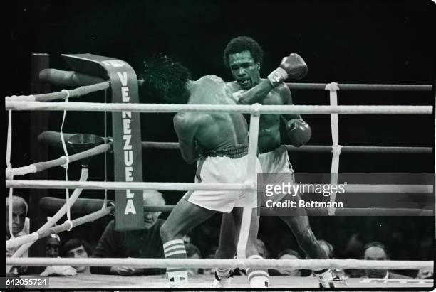 Montreal, Canada: Sugar Ray Leonard looks like one mean dude as he throws a hard right at challenger Roberto Duran during their WBC welterweight...