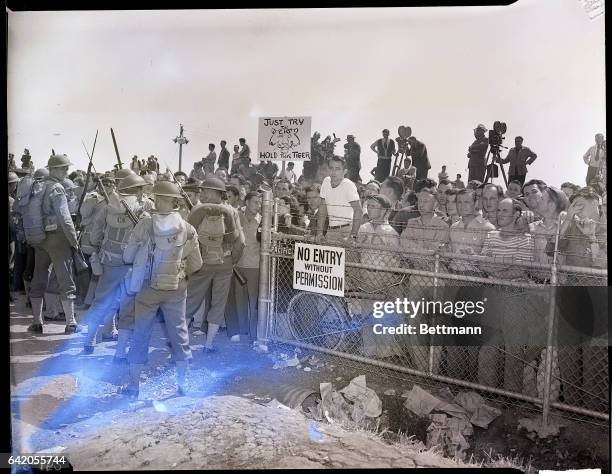Inglewood, CA-Bayonets gleaming, U.S. Army soldiers push back C.I.O. Pickets as the government moved in to end a four-day layoff at the North...