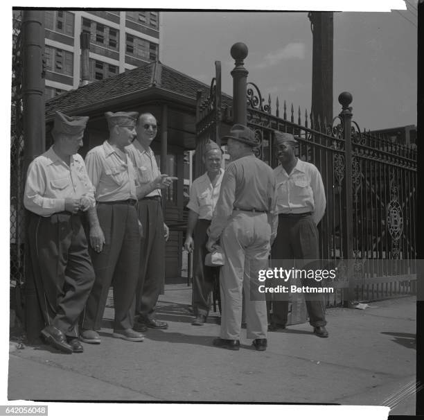 Uniformed members of the United Auto Workers-CIO Local stop an employee from entering the strike-bound Dodge plant July 19th. Many afternoon shift...