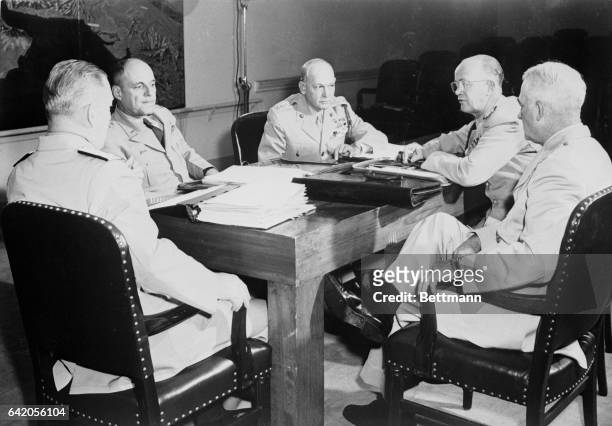 Rarely photographed in session, the Joint Chiefs of Staff are shown above during a meeting in Washington. Left to right, they are: Admiral Arthur W....