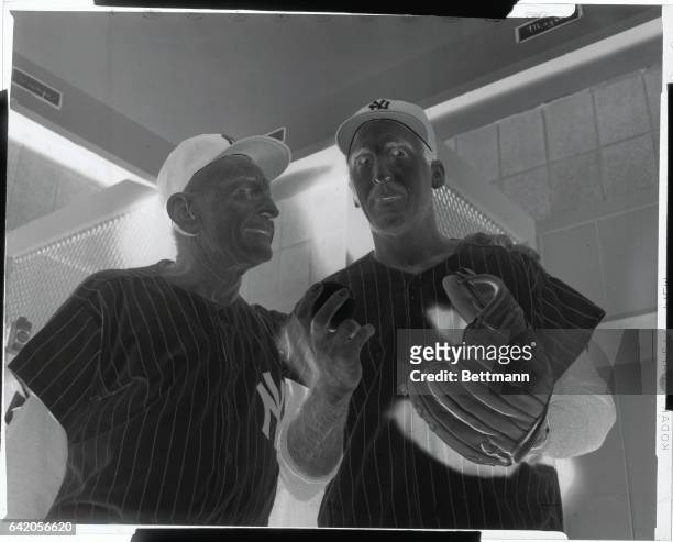 Grabbing himself a double handful of pennant insurance named Sal Maglie, manager Casey Stengel welcomes the ex-Brooklyn star to Yankee Stadium. Here...