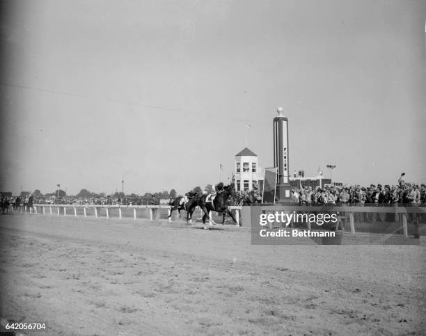 Hill Gail, in the great tradition of Calumet Farm, nearly at the finish line of a thrilling victory in the 78th running of the Kentucky Derby at...