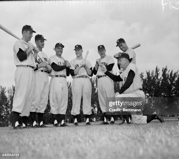 Yankee outfielders line up for inspection by manager Casey Stengel at the Champions spring training headquarters in St. Petersburg. Left to right:...