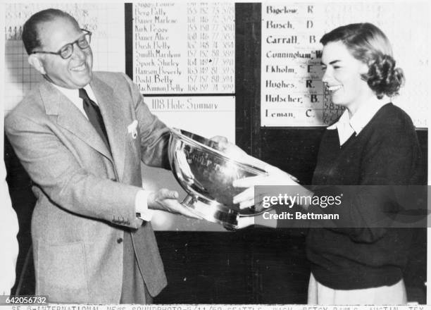 Seattle, Washington: Betsy Rawls, Austin, Texas, won the Weathervane Cross Country Golf Tournament here today when she blazed around the Broadmoor...